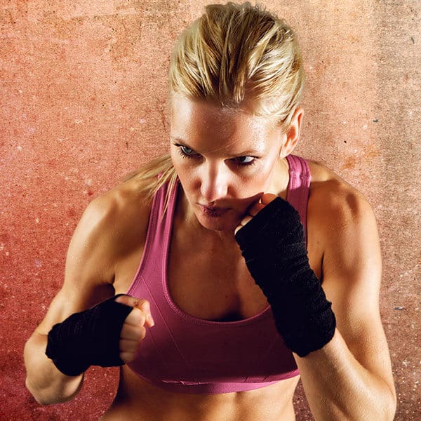Mixed Martial Arts Lessons for Adults in Brookfield  - Lady Kickboxing Focused Background