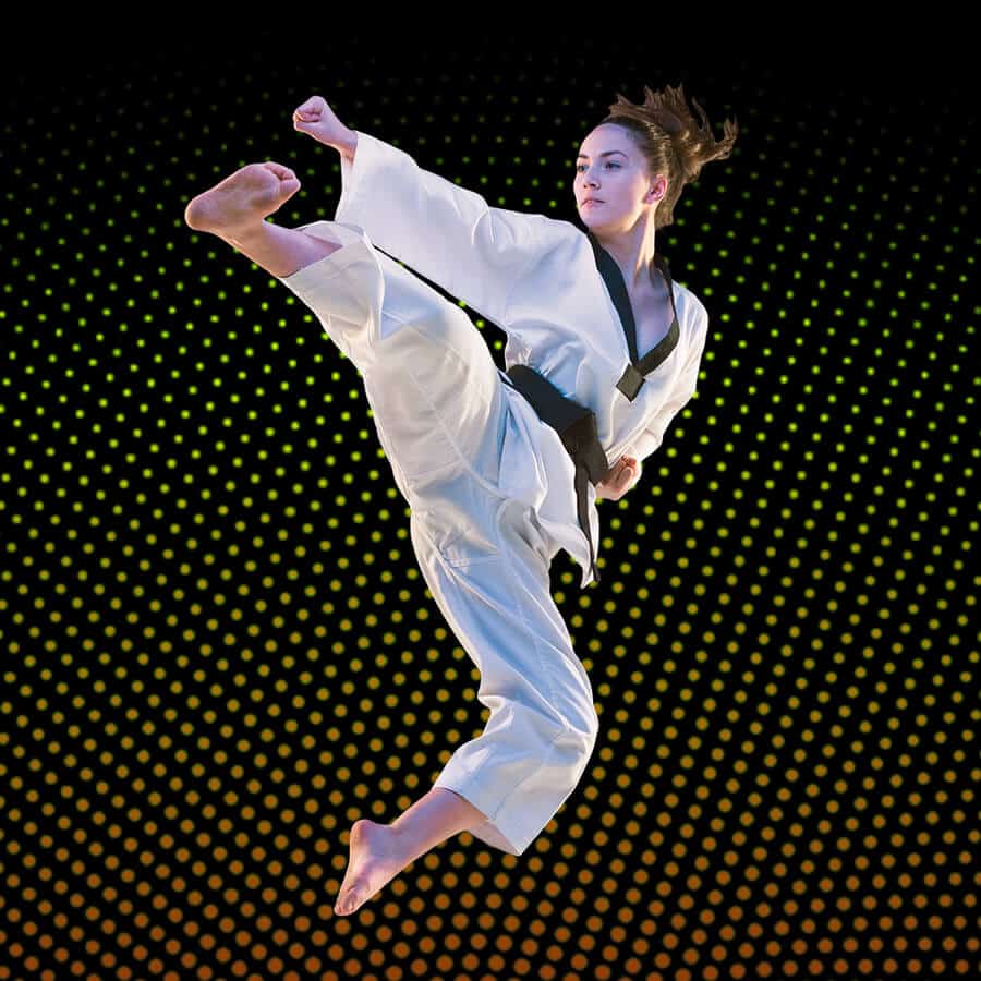Martial Arts Lessons for Adults in Brookfield  - Girl Black Belt Jumping High Kick